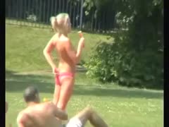 Spy movie of boobalicious blond sweetheart playing ball topless in public park